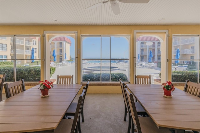 sunroom featuring a wealth of natural light and ceiling fan