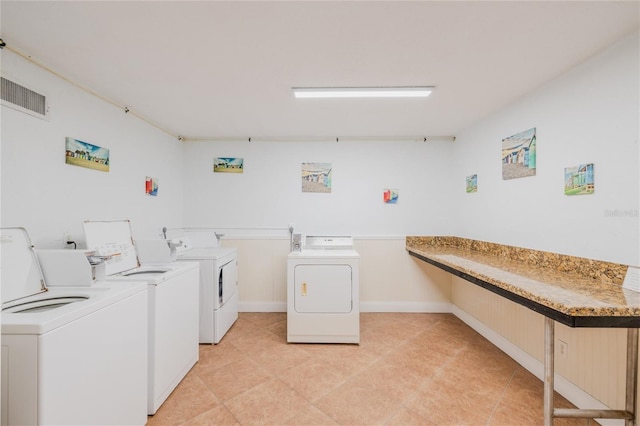 laundry room featuring separate washer and dryer