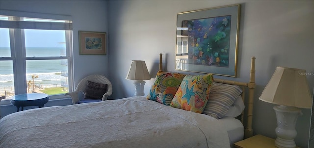 bedroom featuring a water view