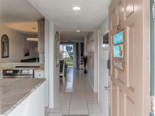 hallway with light tile patterned floors