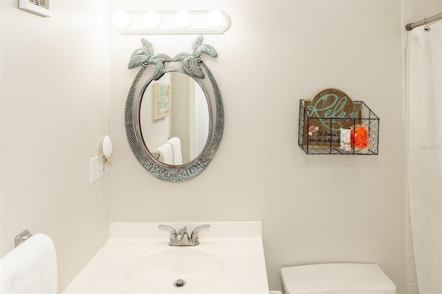 bathroom with toilet and sink