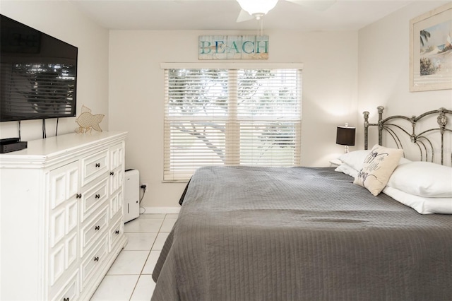 tiled bedroom with ceiling fan