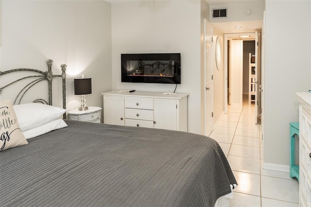 bedroom with light tile patterned floors