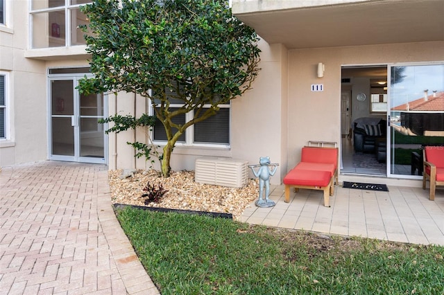 doorway to property featuring a patio area