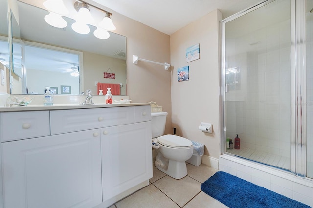 bathroom with ceiling fan, toilet, walk in shower, tile patterned floors, and vanity