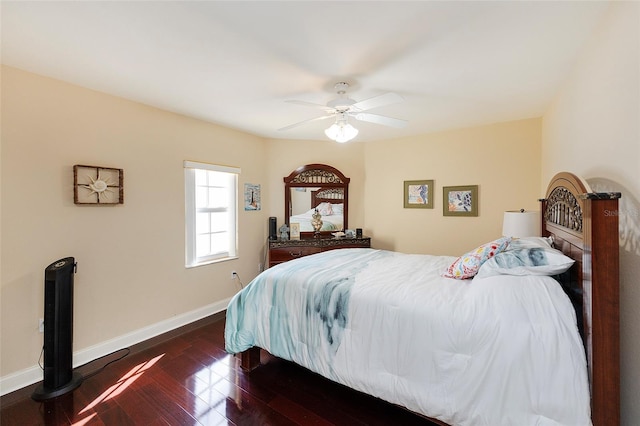 bedroom with ceiling fan and dark wood-type flooring