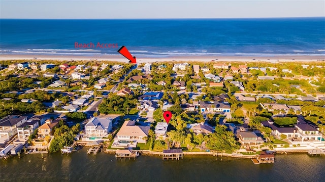 bird's eye view featuring a water view and a view of the beach