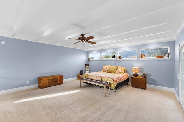 bedroom featuring ceiling fan, beam ceiling, and light colored carpet