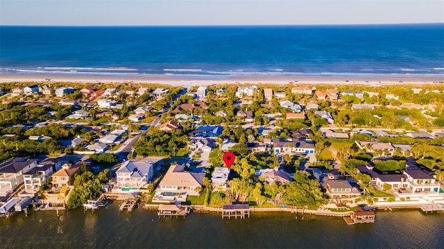 bird's eye view featuring a beach view and a water view