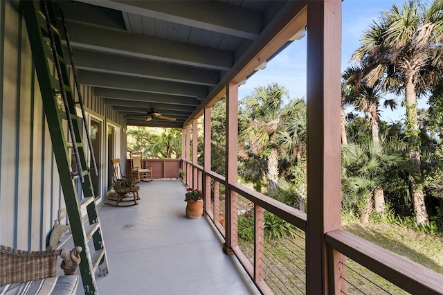 view of patio featuring a balcony and ceiling fan