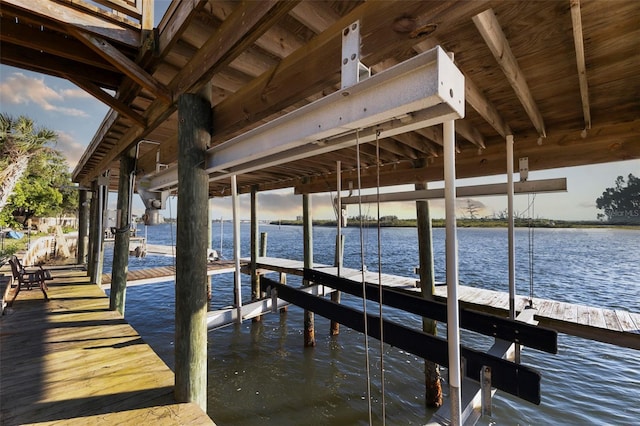 dock area featuring a water view and boat lift