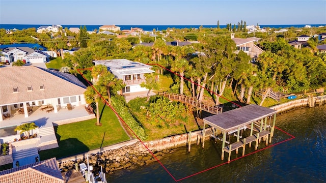 birds eye view of property featuring a water view