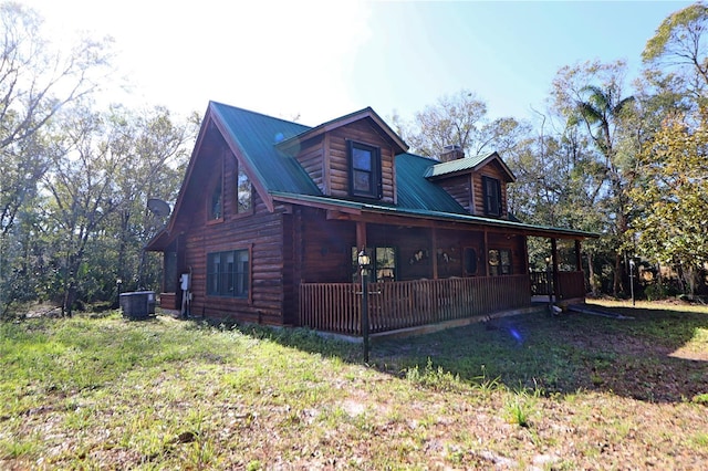 view of home's exterior with a porch and cooling unit