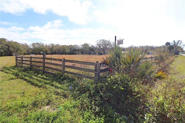 view of gate featuring a rural view