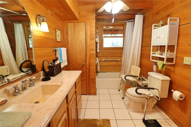 full bathroom featuring wooden walls, shower / tub combo with curtain, ceiling fan, and tile patterned flooring