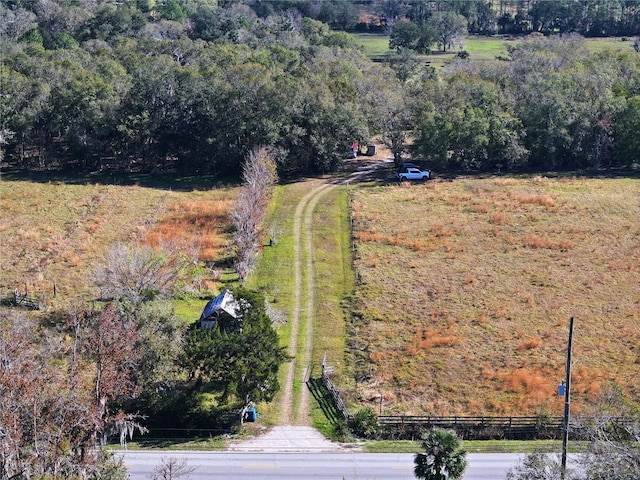 birds eye view of property featuring a rural view