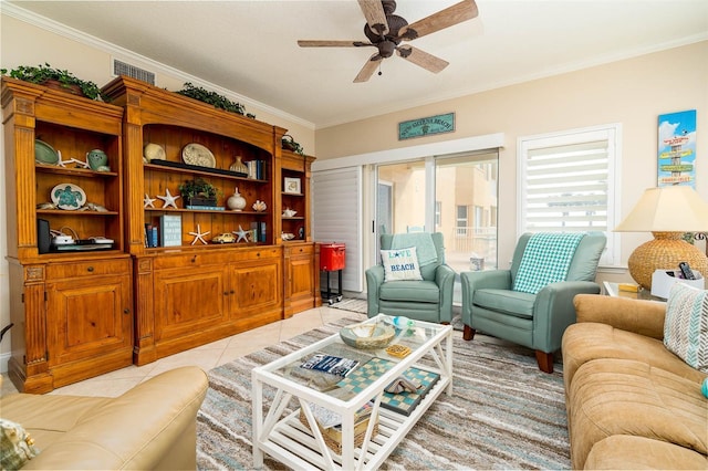 living room with ceiling fan, light tile patterned floors, and crown molding