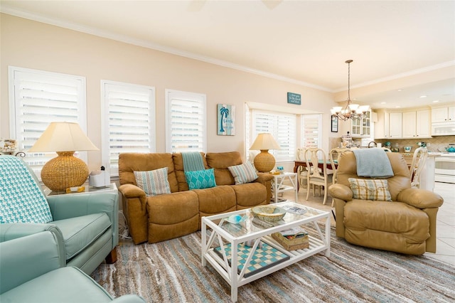 living room with a chandelier and ornamental molding