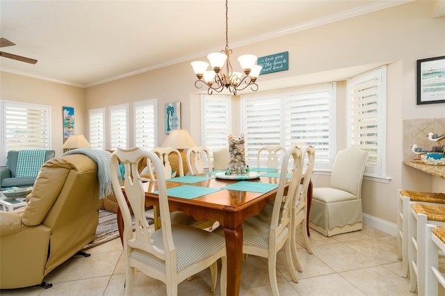 dining area featuring light tile patterned floors, an inviting chandelier, ornamental molding, and a healthy amount of sunlight