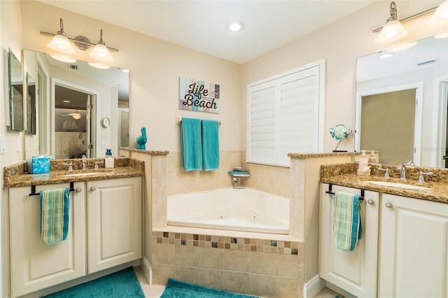 bathroom featuring shower with separate bathtub and vanity