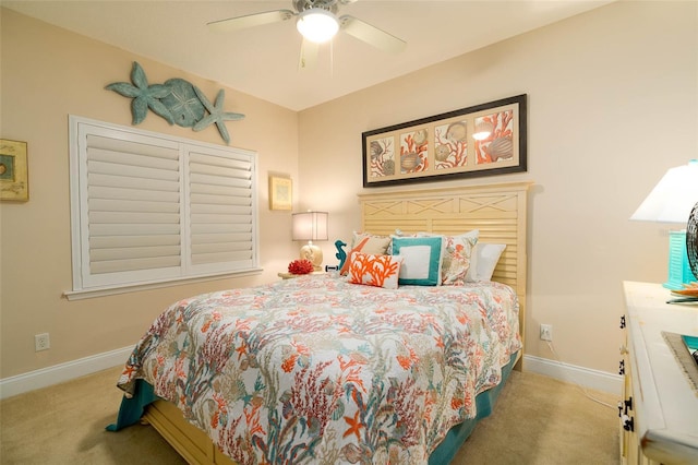 bedroom with light carpet and ceiling fan