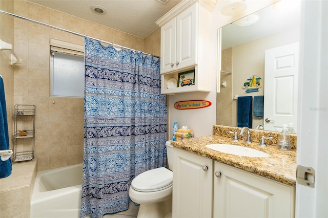 full bathroom with a textured ceiling, vanity, toilet, and shower / bathtub combination with curtain