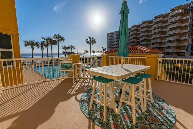 balcony featuring a water view