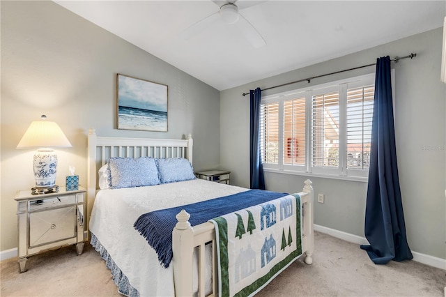 carpeted bedroom with ceiling fan and lofted ceiling