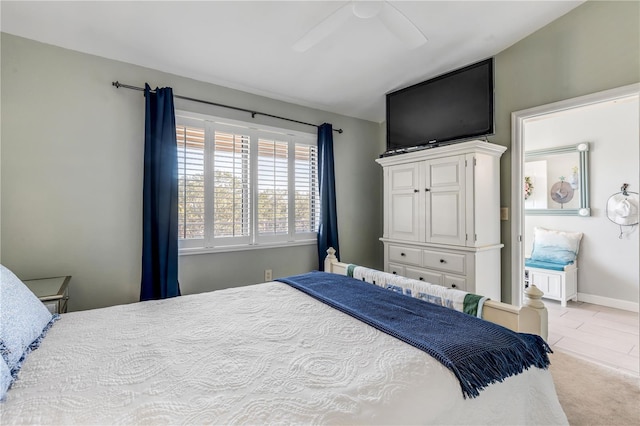 bedroom with ceiling fan and light colored carpet