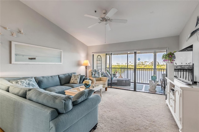 living room with light colored carpet, vaulted ceiling, and ceiling fan