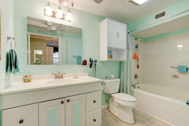 full bathroom featuring shower / bath combination with curtain, vanity, toilet, and ceiling fan