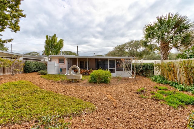 back of property featuring a sunroom