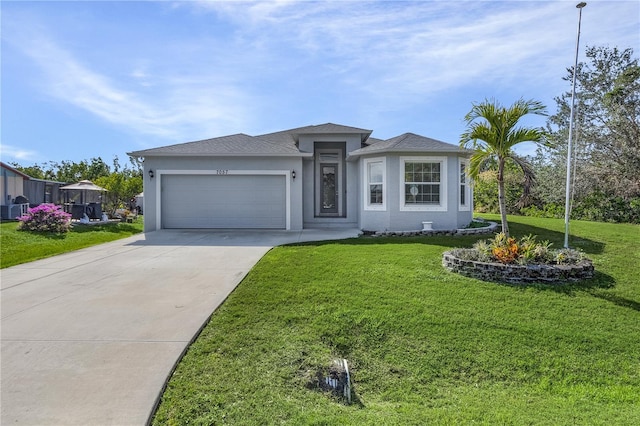 view of front of house featuring a front lawn and a garage