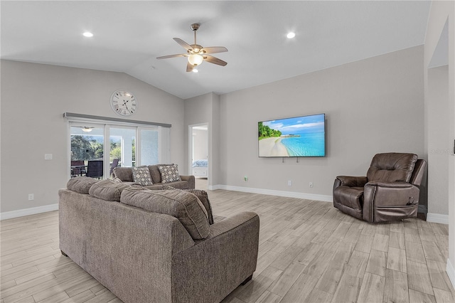 living room with ceiling fan, light hardwood / wood-style flooring, and lofted ceiling