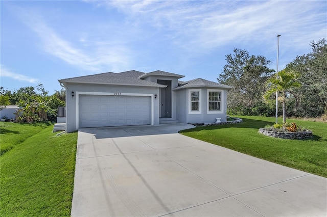 view of front facade with a front yard and a garage