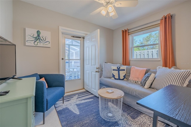 living area featuring a ceiling fan