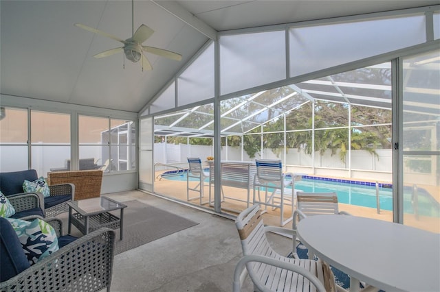 sunroom / solarium featuring lofted ceiling with beams and ceiling fan