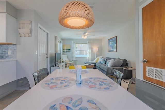 dining room with visible vents and ceiling fan