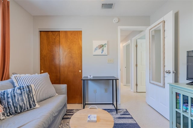 living room with baseboards and visible vents