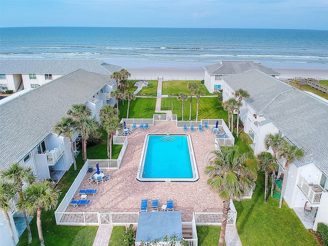 bird's eye view featuring a view of the beach and a water view