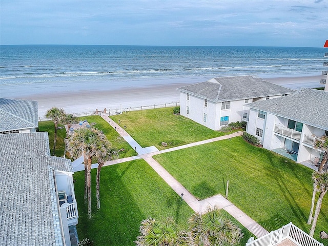 birds eye view of property featuring a view of the beach and a water view