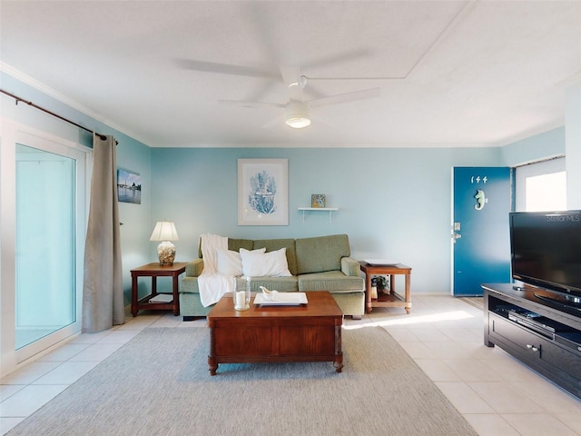 living room with ceiling fan, crown molding, and light tile patterned flooring