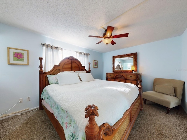 bedroom with a textured ceiling, ceiling fan, and dark colored carpet