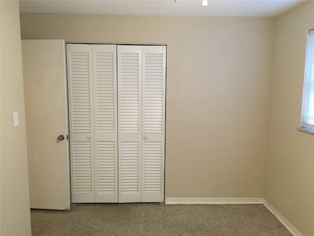 unfurnished bedroom with a closet