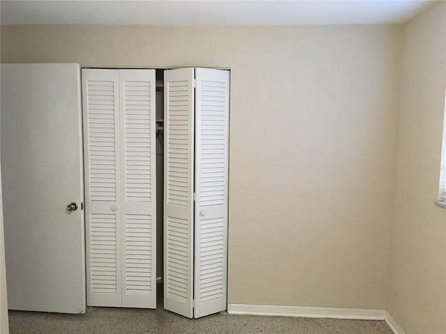 unfurnished bedroom featuring a closet