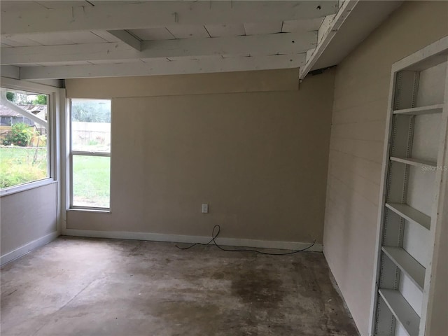 spare room with concrete floors