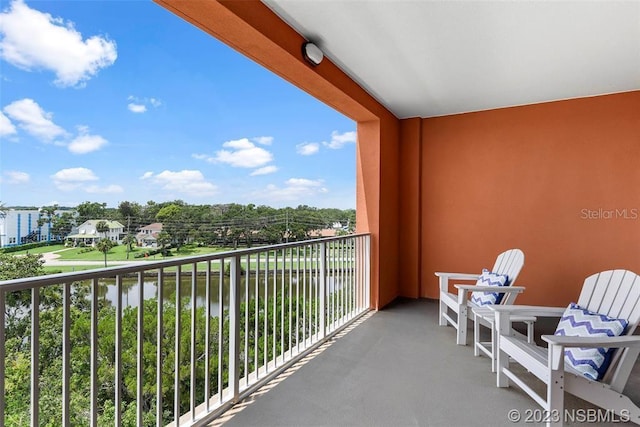 balcony featuring a water view