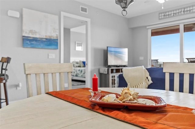 dining space featuring ceiling fan