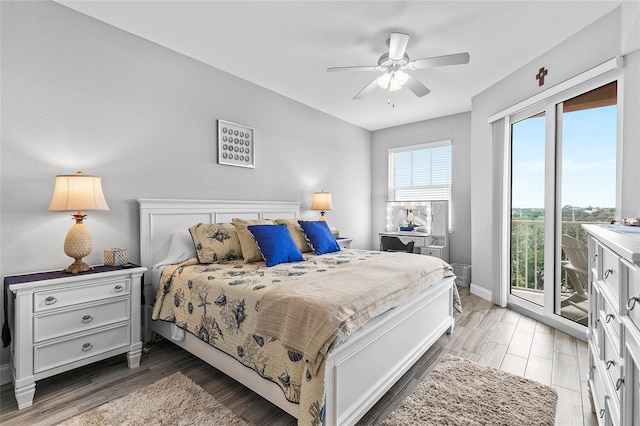 bedroom with access to exterior, ceiling fan, and multiple windows