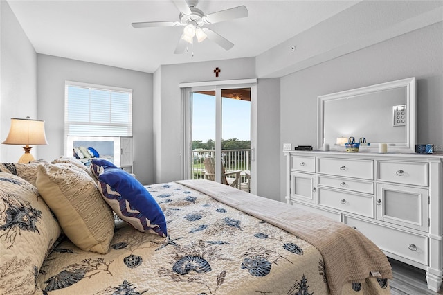 bedroom with access to exterior, hardwood / wood-style flooring, and ceiling fan